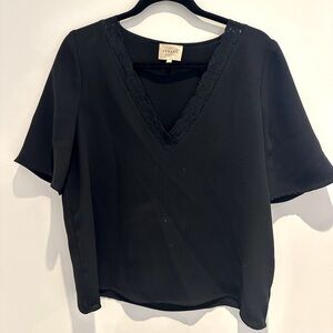 Sezane black v-neck blouse with lace trim. Size 40